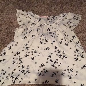 White shirt with birds flying